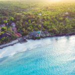 an aerial view of a beach and a resort