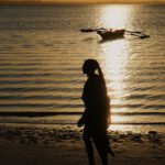 a person walking on a beach